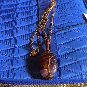 Fluorite stone in hand put together copper